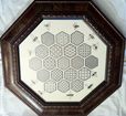 Bees swarming round their honeycomb